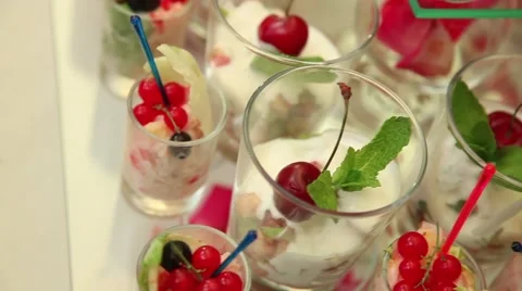 Snacks and desserts are on the table in the plates and glasses Stock Footage 52816965