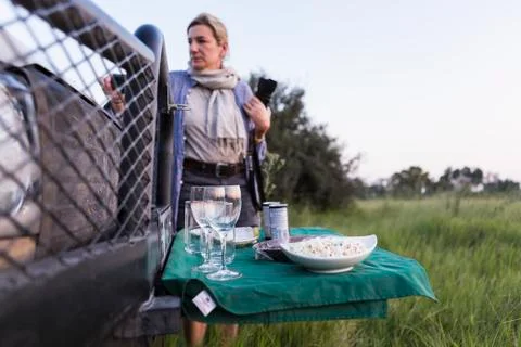 Snacks and drinks on fold out table, safari vehicle, Botswana Stock Photos