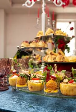Snacks and salads on the buffet table. catering at the event. Stock Photos