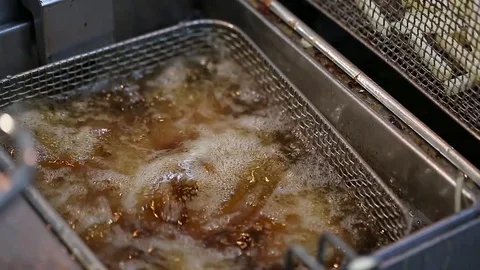 Snacks boil in deep-fried Stock Footage 73981517