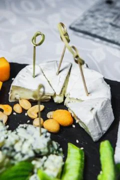 Snacks with meat and vegetables. Tapas with salmon and pickled cucumber. Pros Stock Photos