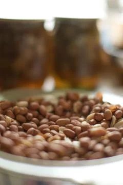 Snacks, nuts and chips in glassware on the wooden brown table. Stock Photos