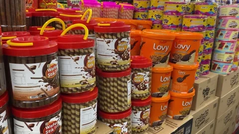Snacks in plastic containers are sold in supermarket Video stock 347541924