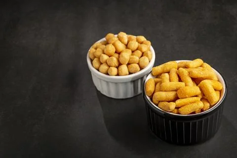 Snacks in ramekin on the table. Stock Photos