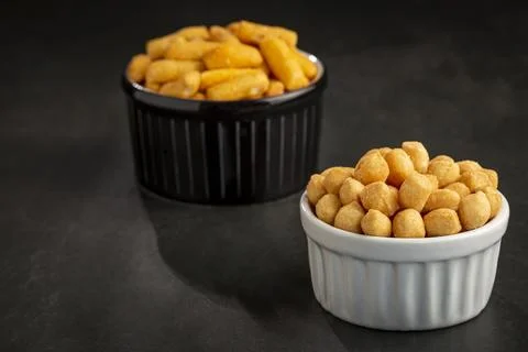 Snacks in ramekin on the table. Stock Photos
