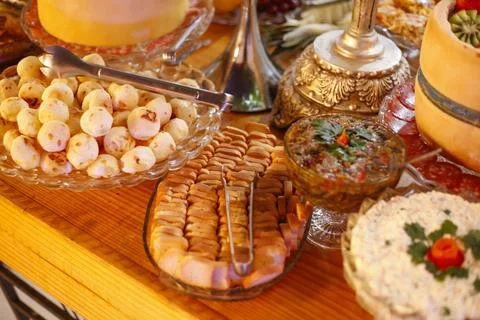 Snacks table with cheese bread sliced cold cuts and various delicious accom.. Stock Photos