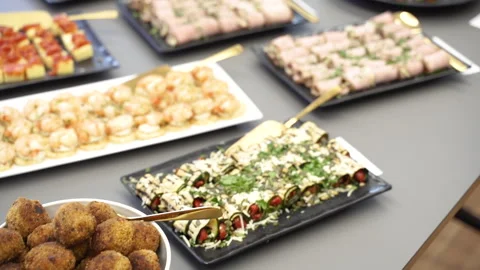 Snacks. There are trays with different foods on the table. Stock Footage 306183004