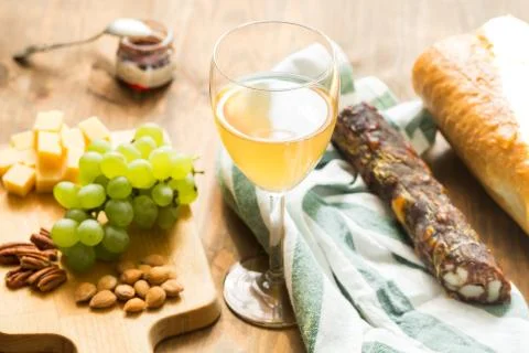 Snacks for wine: grapes, cheese, nuts Stock Photos