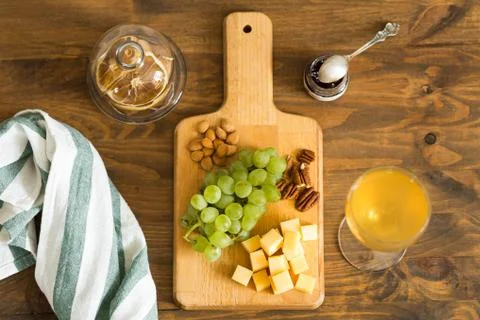 Snacks for wine: grapes, cheese, nuts Stock Photos