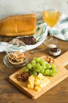 Snacks for wine: grapes, cheese, nuts Stock Photos