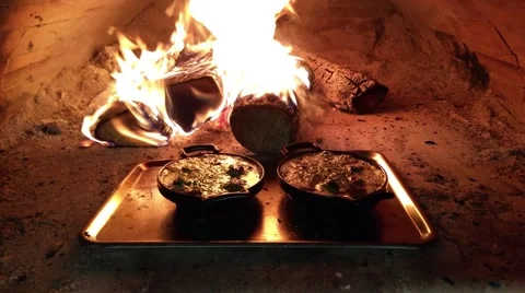 Snail escargot pans, in a wooden heated oven, at a restaurant kitchen Stock Footage 59198973