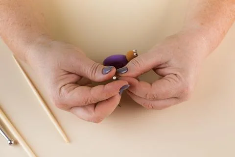 A snail made of polymer clay. Step-by-step instruction. Step 12 make antennas. Foto stock