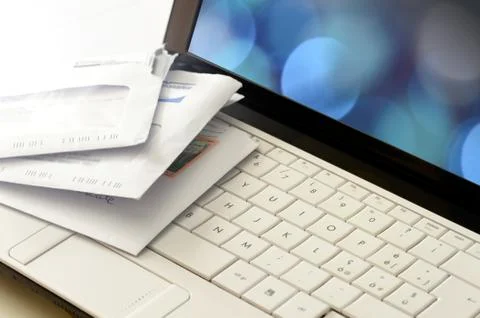 Snail mail post on a computer keyboard Stock Photos