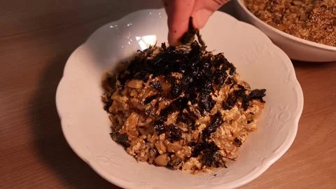 Snail soybean paste rice bowl topped with seaweed powder Stock Footage 256911148