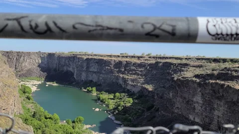 Snake River view from Hansen Bridge parking  fence view in Idaho Stock Footage 169326394