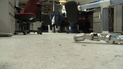 Snake-like robot machine crawling on a floor Stock Footage 99052945