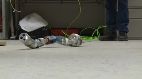 Snake-like robot machine moving on a floor Stock Footage 99052669