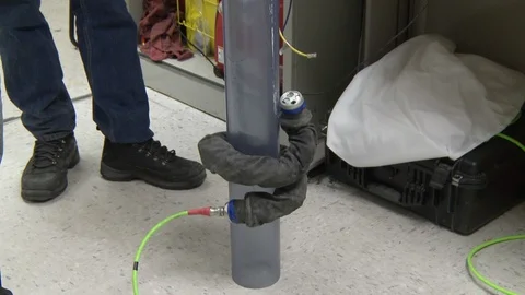 Snake-like robot machine on pole Stock Footage 99052611