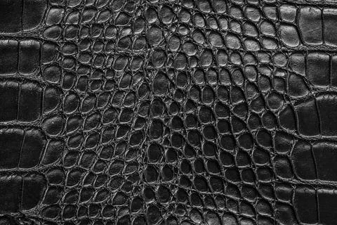 Snake skin imitation abstract pattern black background Stock Photos