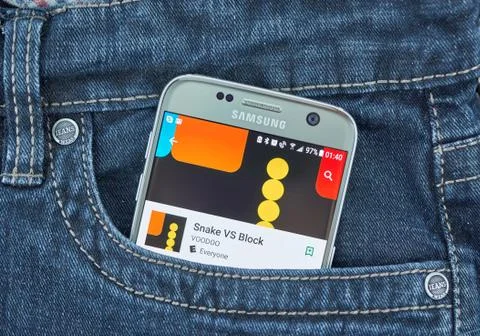 Snake vs Block mobile game on screen of Samsung Stock Photos