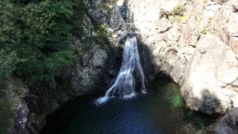 The Snake Waterfall (Cascata del Serpente) seen from a drone flying upwards Stock Footage 317513270