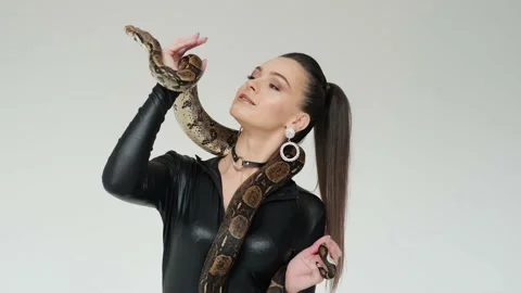 Snake on a woman's hands. Slow motion Stock Footage 147954144