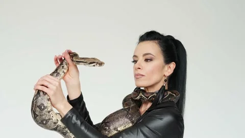 Snake on a woman's hands. Slow motion Vercion 2 Stock Footage 149834114