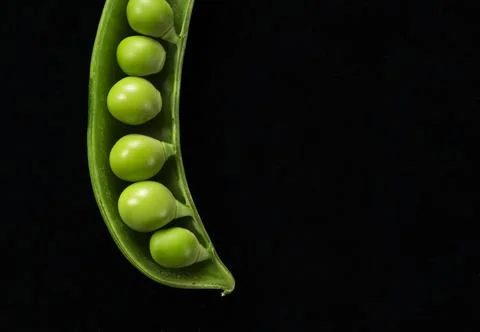 Snap peas placed on a black background Stock Photos
