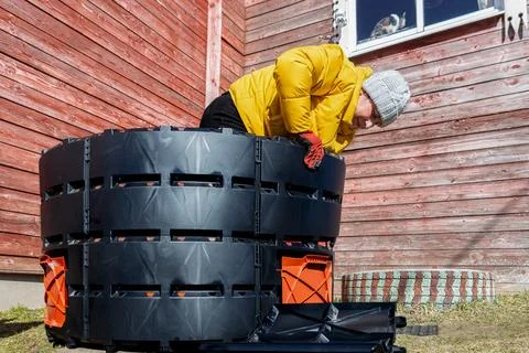 Snap together construction for quick assembly of compost bin, woman gardene.. Stock Photos