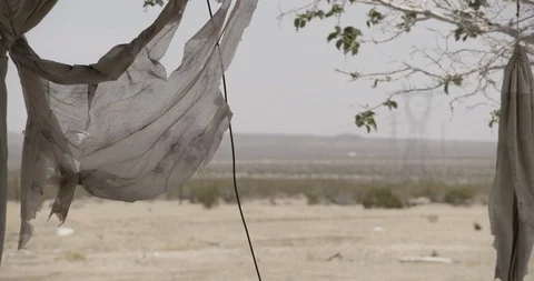 Snap Zoom from Broken Window to Tattered Curtains Stock Footage 89943182