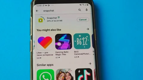 Snapchat application is installed on a mobile device. Snapchat program icon on a Stock Footage 207405105