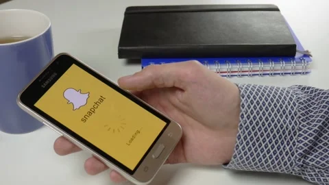 The Snapchat application is loaded for a very long time Stock Footage 99833836