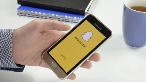 The Snapchat application is loaded for a very long time Stock Footage 99834734