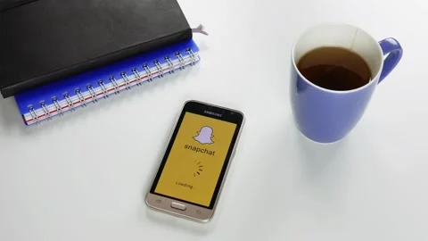 The Snapchat application is loaded for a very long time Stock Footage 99836670