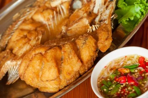 Snapper topped with sauce Stock Photos