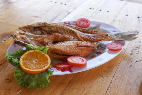 Snapper topped with sauce Stock Photos
