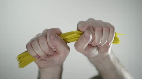 Snapping spaghetti in half Stock Footage 50672271