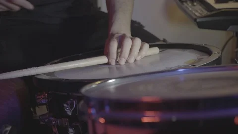 Snare view while drum playing with stick and hand Stock Footage 129097984