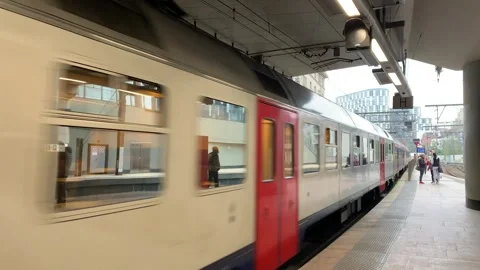 SNCB Belgian train arrives at Brussels Schuman railway station. Belgium Stock Footage 240216214