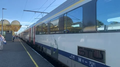 SNCB Belgian train arrives at De Panne train, railway station. Belgium Stock-Footage 251637074