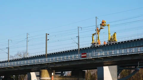 SNCF catenary maintenance team at work on a railway bridge (Paris,France) Stock Footage 235295541