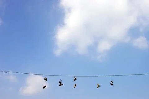 Sneakers on a electric wire Stock Photos