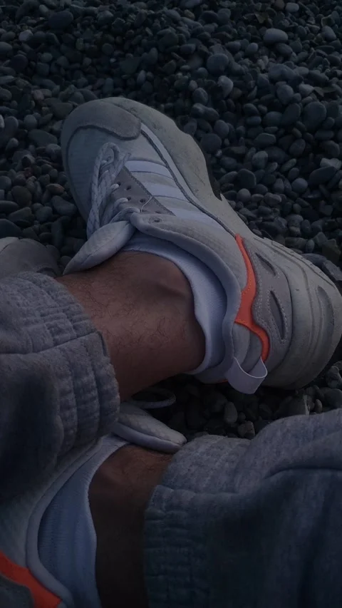 Sneakers on the evening sea Stock Footage 236916963