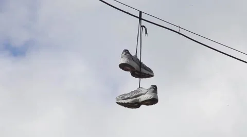 Sneakers hanging on the wire Stock Footage 50888768