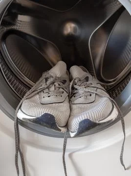 Sneakers inside the washing machine Foto stock