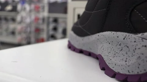 Sneakers on the store shelf. Sneakers on the background of the store. Stock Footage 220153492