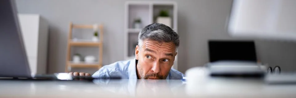 Sneaky Mature Man Avoiding Work Stock Photos