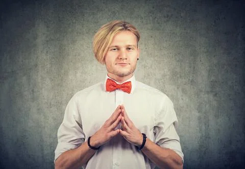 Sneaky scheming man looking at camera Stock Photos