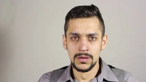 Sneezing young bearded man Stock-Footage 73685891