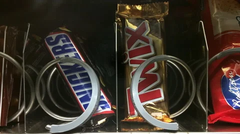 Snicker and Twix coming out of vending machine Stock Footage 47459202